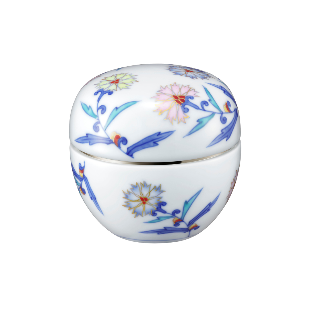 Decorative ceramic container with floral patterns on a white background